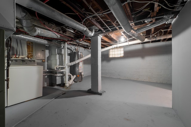 basement featuring gas water heater and washer / clothes dryer