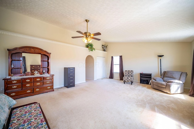 sitting room featuring carpet flooring, a textured ceiling, and ceiling fan