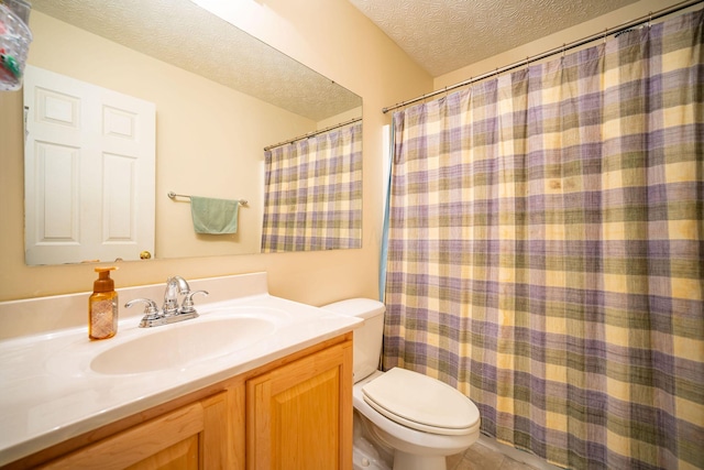 bathroom featuring a textured ceiling, vanity, a shower with curtain, tile patterned flooring, and toilet