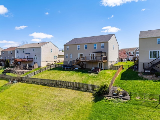 rear view of property with a residential view, a fenced backyard, and stairs