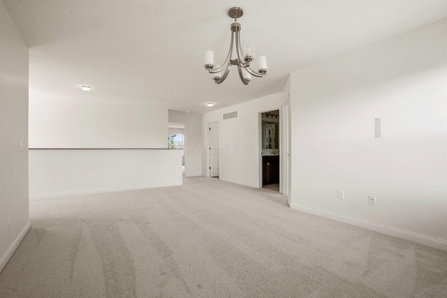 5388 Middlebury Lp, Lewis Center, OH 43035 - spare room with light carpet, visible vents, baseboards, and an inviting chandelier