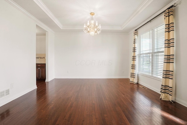 5388 Middlebury Lp, Lewis Center, OH 43035 - spare room with visible vents, ornamental molding, an inviting chandelier, and wood finished floors