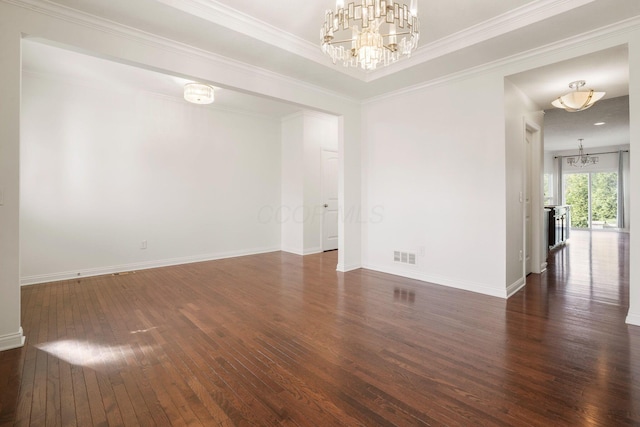 5388 Middlebury Lp, Lewis Center, OH 43035 - spare room featuring visible vents, baseboards, ornamental molding, a chandelier, and hardwood / wood-style flooring