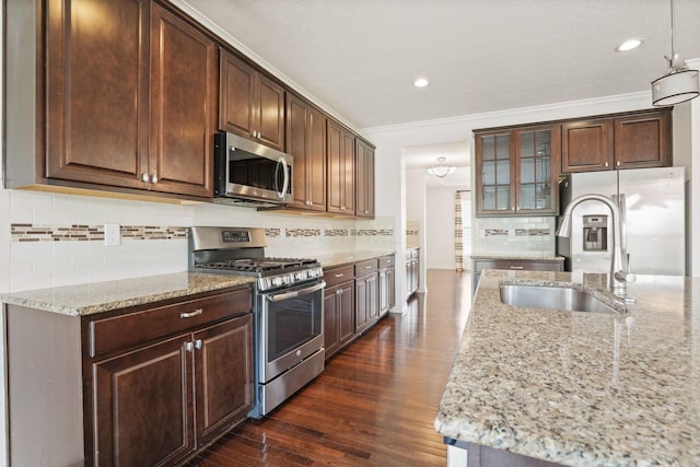 5388 Middlebury Lp, Lewis Center, OH 43035 - kitchen featuring dark wood-style flooring, light stone counters, glass insert cabinets, crown molding, and appliances with stainless steel finishes