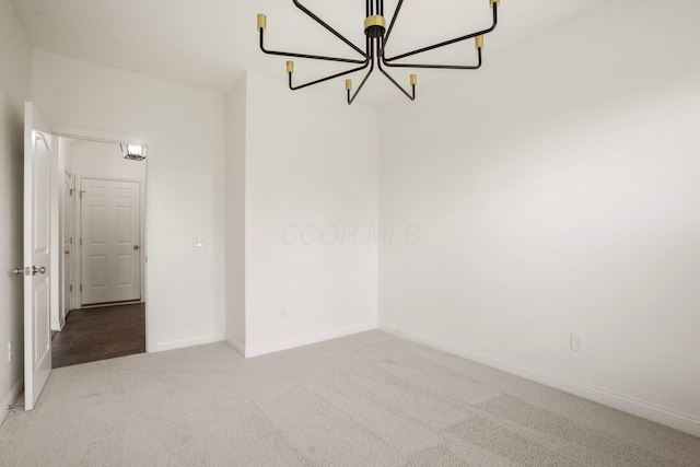 5388 Middlebury Lp, Lewis Center, OH 43035 - spare room with a chandelier, carpet flooring, and baseboards