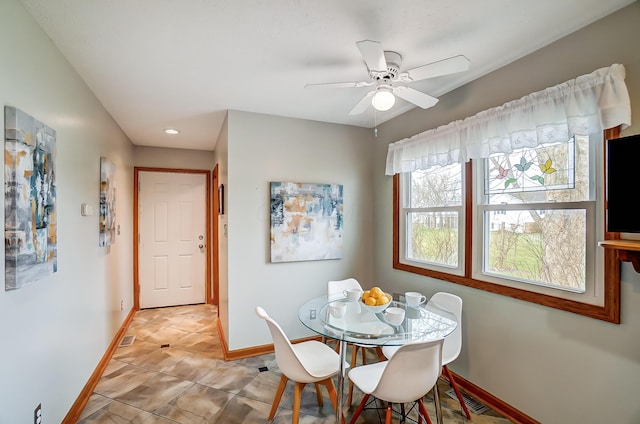 dining area with a ceiling fan, light tile patterned floors, baseboards, and visible vents