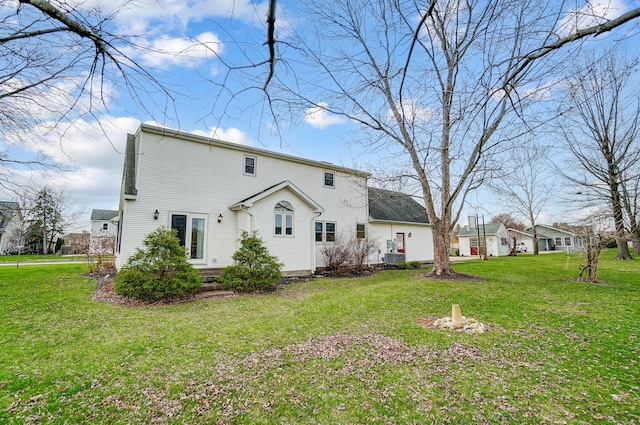back of property with a yard