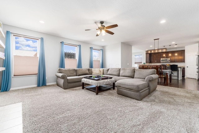 living room with recessed lighting, baseboards, and ceiling fan