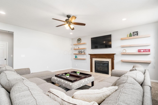 carpeted living room featuring baseboards, recessed lighting, ceiling fan, and a glass covered fireplace