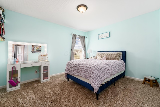 bedroom featuring baseboards and carpet