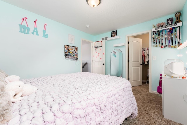 carpeted bedroom featuring visible vents