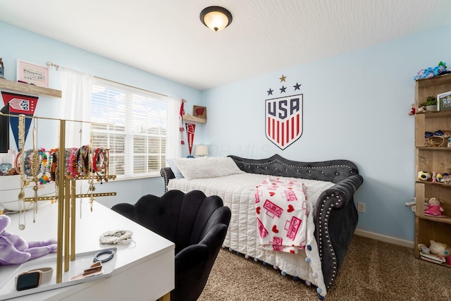 carpeted bedroom with baseboards