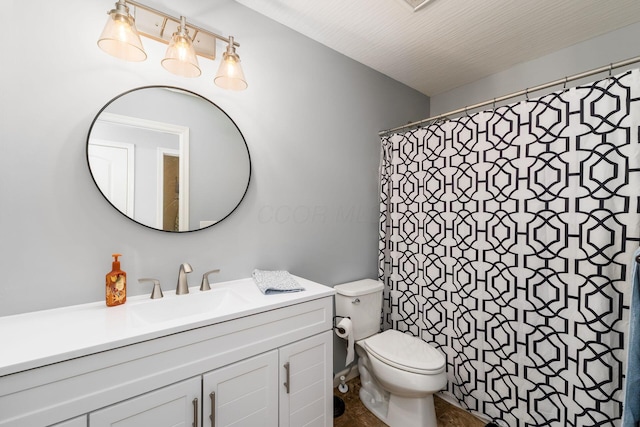 full bathroom with toilet, vanity, and curtained shower