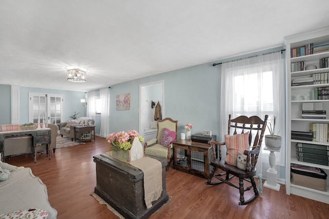 28 John St, Mount Sterling, OH 43143 - living area featuring healthy amount of natural light and wood finished floors