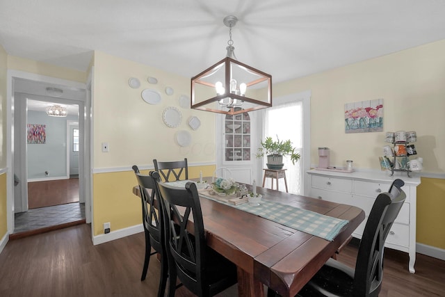 28 John St, Mount Sterling, OH 43143 - dining space with a chandelier and dark wood finished floors
