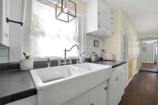 28 John St, Mount Sterling, OH 43143 - kitchen with white cabinets, dark wood-style floors, backsplash, and dishwasher