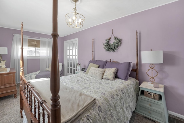 28 John St, Mount Sterling, OH 43143 - carpeted bedroom with a chandelier and baseboards