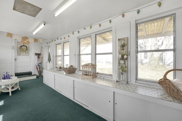 28 John St, Mount Sterling, OH 43143 - interior space featuring plenty of natural light, light countertops, dark colored carpet, and white cabinets