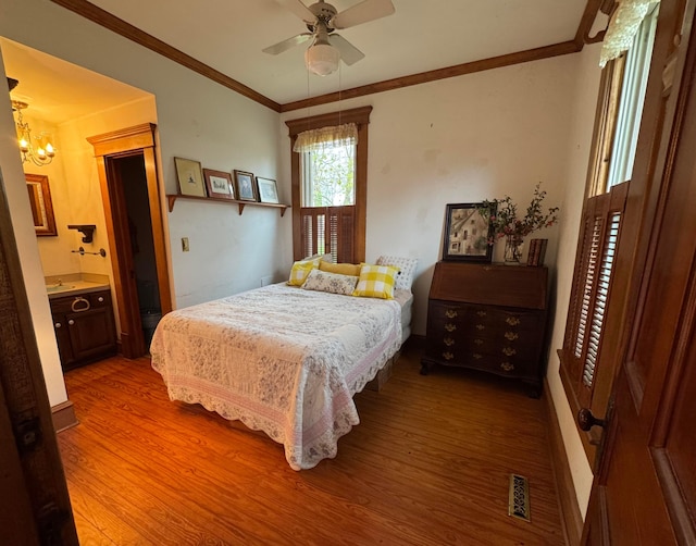 4175 Reynoldsburg Baltimore Rd NW, Baltimore, OH 43105 - bedroom featuring wood finished floors, ceiling fan with notable chandelier, ensuite bath, ornamental molding, and visible vents