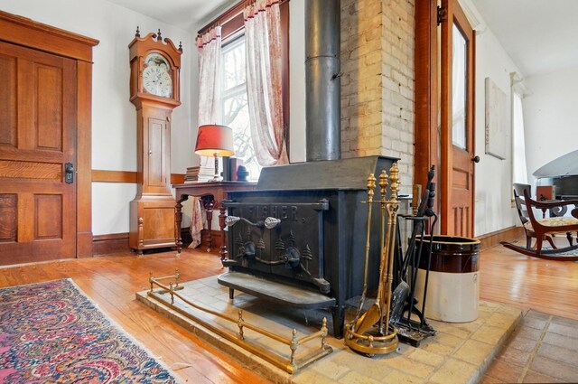 4175 Reynoldsburg Baltimore Rd NW, Baltimore, OH 43105 - interior space featuring hardwood / wood-style floors, a wood stove, and baseboards