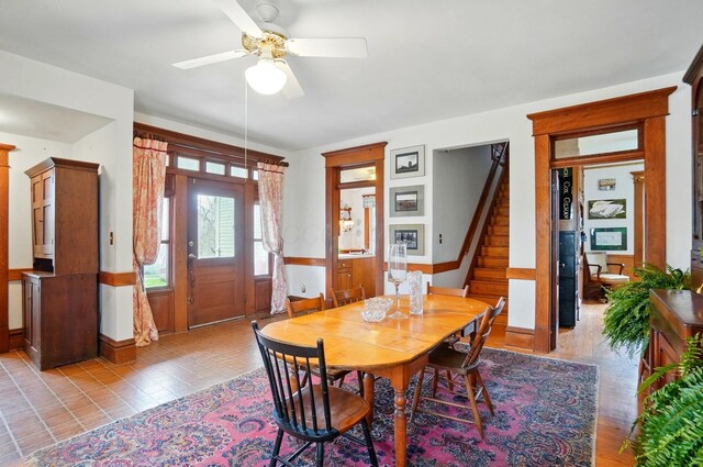 4175 Reynoldsburg Baltimore Rd NW, Baltimore, OH 43105 - dining area featuring a ceiling fan, stairs, and a wainscoted wall