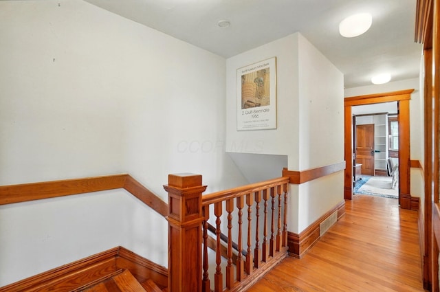 4175 Reynoldsburg Baltimore Rd NW, Baltimore, OH 43105 - hallway featuring visible vents, light wood-style flooring, baseboards, and an upstairs landing