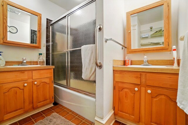 4175 Reynoldsburg Baltimore Rd NW, Baltimore, OH 43105 - bathroom with two vanities, tile patterned floors, enclosed tub / shower combo, and a sink