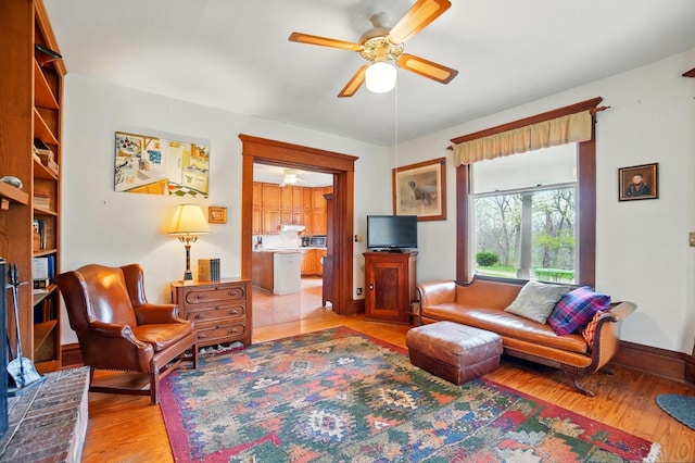 4175 Reynoldsburg Baltimore Rd NW, Baltimore, OH 43105 - living room with baseboards, light wood-style floors, and ceiling fan