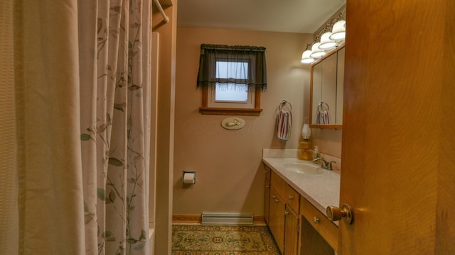 full bath featuring vanity, baseboards, and a baseboard radiator