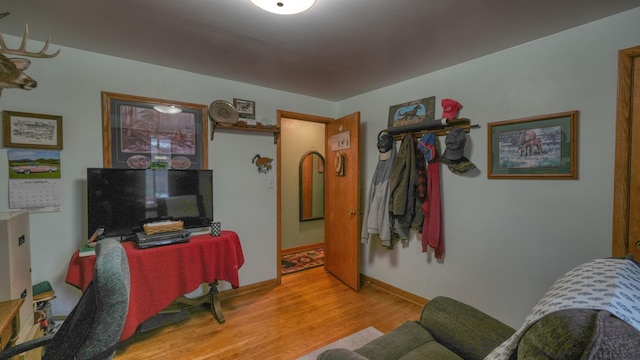 living area with light wood finished floors and baseboards