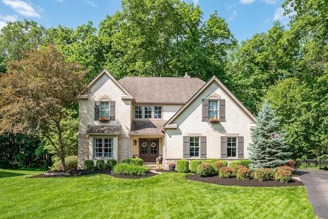 9047 Sequoia Ct, Plain City, OH 43064 - traditional home featuring stucco siding and a front lawn