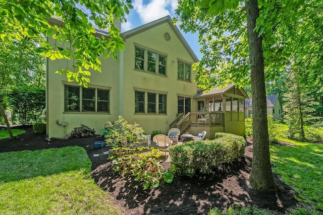 9047 Sequoia Ct, Plain City, OH 43064 - back of property featuring stucco siding and a lawn