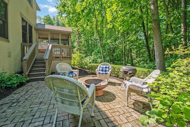 9047 Sequoia Ct, Plain City, OH 43064 - view of patio with an outdoor fire pit, a sunroom, and stairs