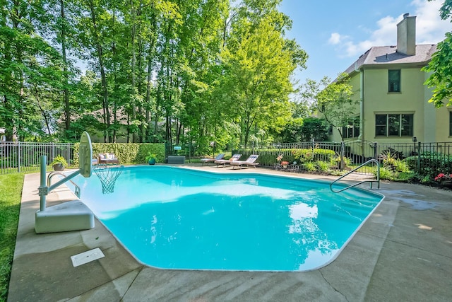 9047 Sequoia Ct, Plain City, OH 43064 - view of swimming pool with a patio, view of scattered trees, and a water slide