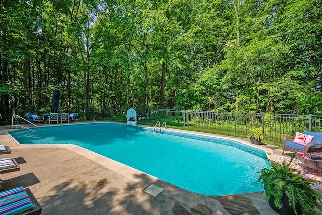 9047 Sequoia Ct, Plain City, OH 43064 - view of pool with a patio area, a fenced backyard, and a view of trees
