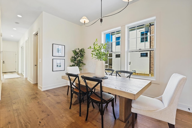 dining area with recessed lighting, baseboards, and hardwood / wood-style flooring