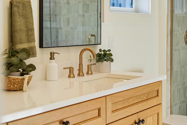 full bathroom with tiled shower, toilet, and vanity