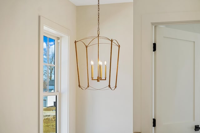 interior details featuring a notable chandelier