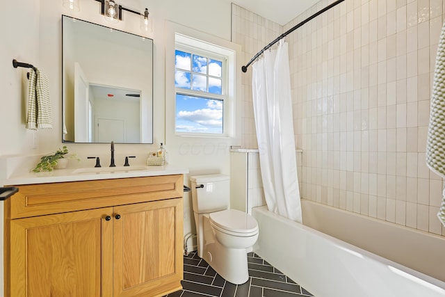 bathroom with vanity, shower / tub combo, and toilet