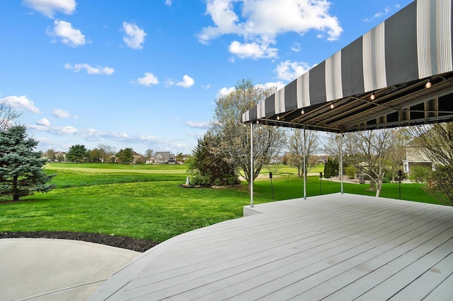 wooden terrace with a yard