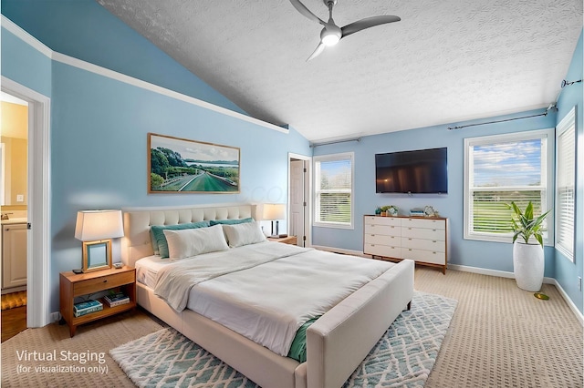 bedroom featuring lofted ceiling, a textured ceiling, baseboards, and light colored carpet