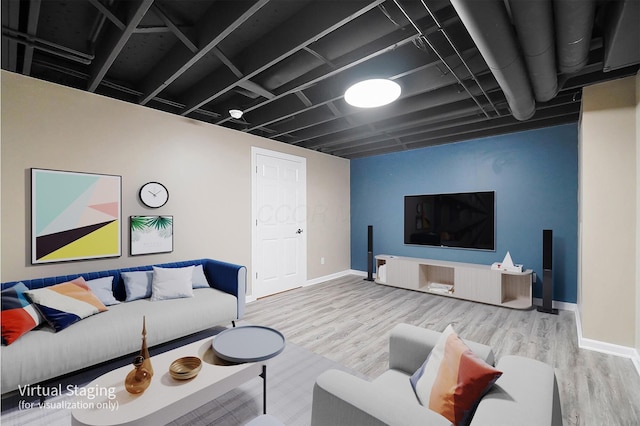 living area featuring wood finished floors and baseboards