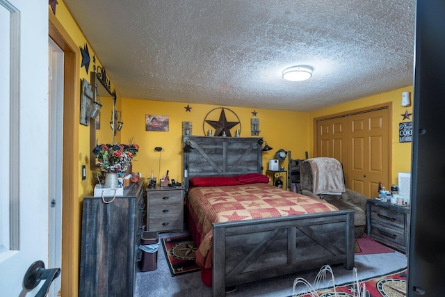 carpeted bedroom with a closet and a textured ceiling