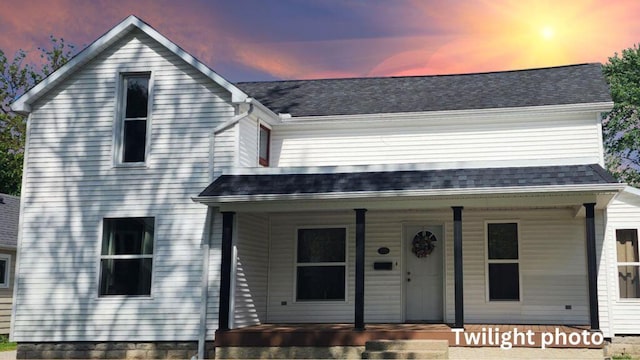 430 N Simon St, Ada, OH 45810 - view of front facade with roof with shingles and covered porch