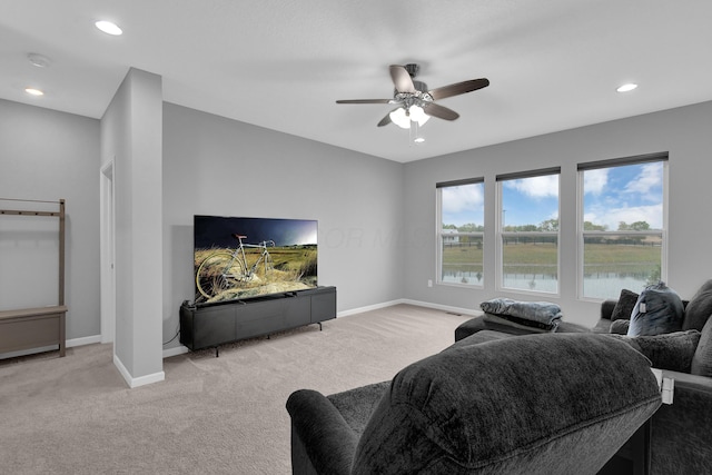 living room with light carpet, baseboards, ceiling fan, and recessed lighting