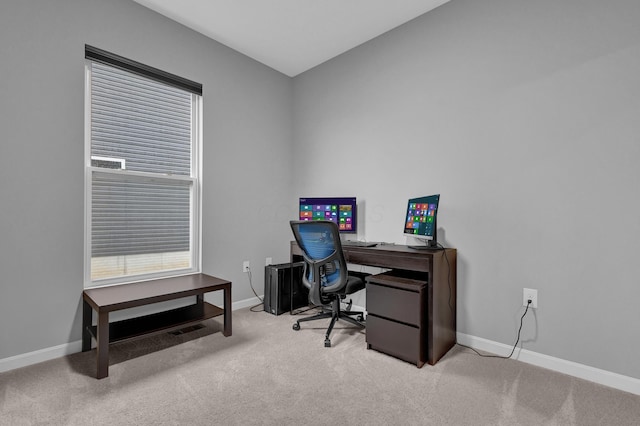 carpeted office with baseboards and visible vents