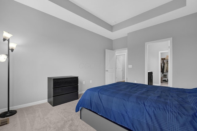 carpeted bedroom with baseboards and visible vents