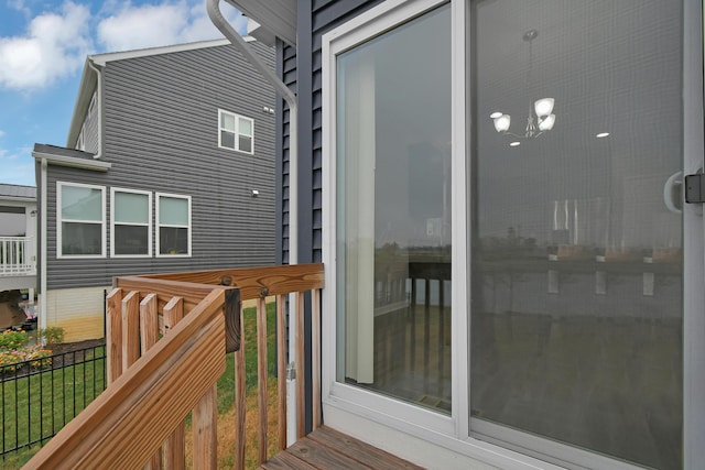 wooden terrace featuring fence