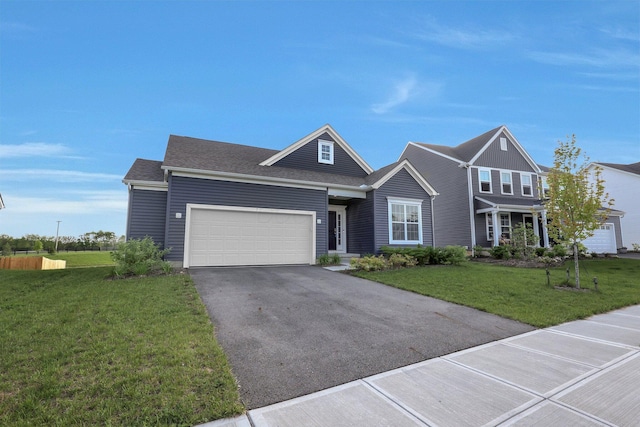 7 Erin Hills Rd, Commercial Point, OH 43116 - view of front of property with driveway, a garage, and a front lawn