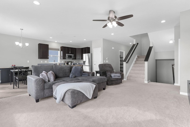 7 Erin Hills Rd, Commercial Point, OH 43116 - living area featuring ceiling fan, recessed lighting, stairway, light colored carpet, and a chandelier